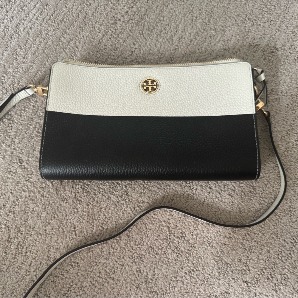 Tory Burch black and white handbag with strap.